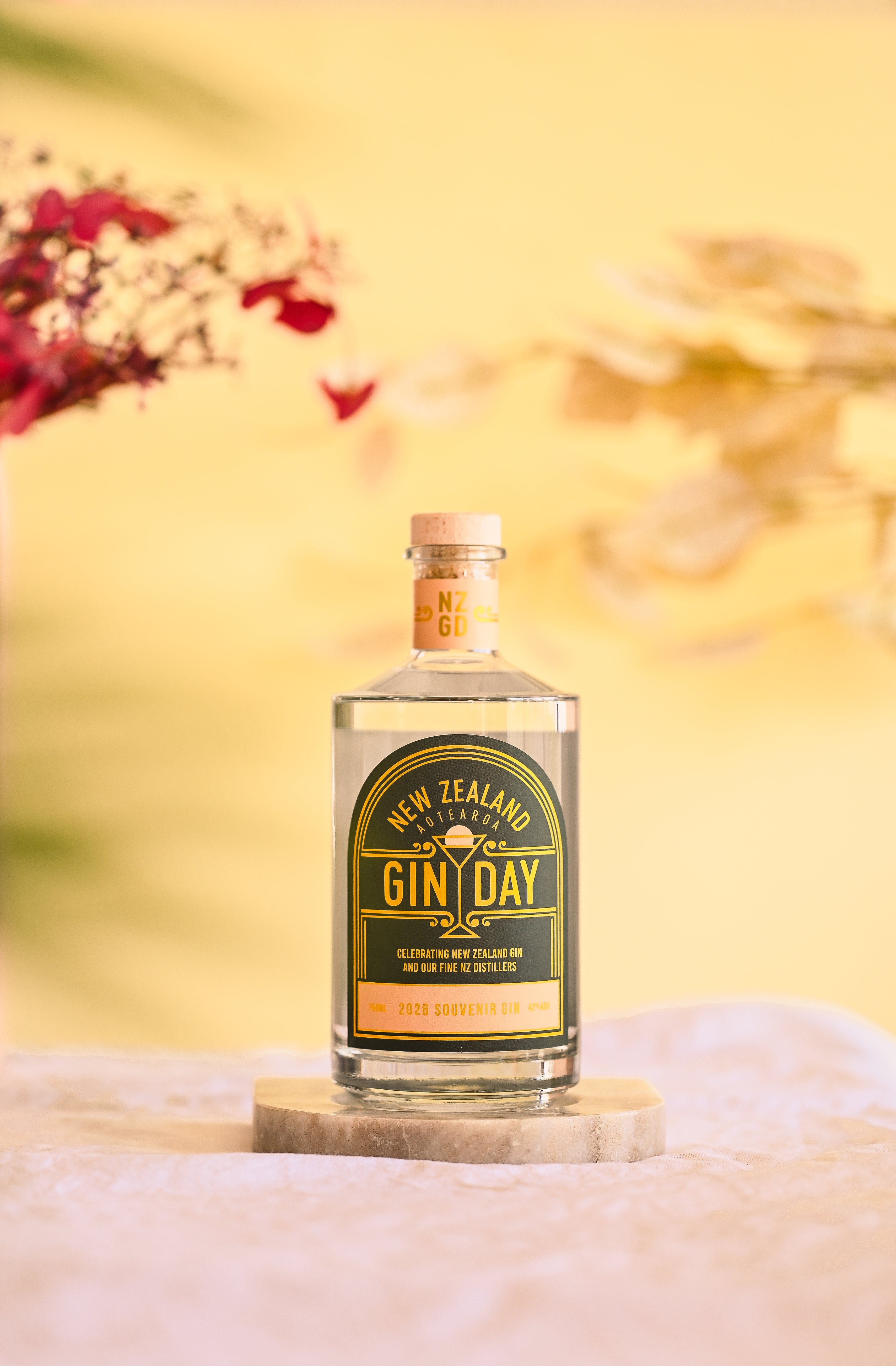 Bottle of NZ Gin Day with blurred flower background